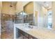 Bathroom featuring a walk-in shower with brown tile and a large countertop with a vessel sink at 13208 Malachite Dr, Bradenton, FL 34211