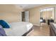 Bedroom with hardwood floors, an open door, a ceiling fan, and mirror door closet at 13696 Orange Sunset Dr # 13696, Tampa, FL 33618