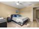 Charming bedroom featuring hardwood floors, a ceiling fan, and a window with a view at 13696 Orange Sunset Dr # 13696, Tampa, FL 33618