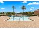 Sparkling community pool with palm trees, lounge chairs and brick paver deck at 13696 Orange Sunset Dr # 13696, Tampa, FL 33618