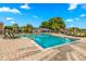 Lovely pool with lounge chairs and a brick paver deck, ideal for relaxation at 13696 Orange Sunset Dr # 13696, Tampa, FL 33618