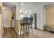 Spacious kitchen with stainless steel appliances, granite countertops, barstool seating and wood flooring at 13696 Orange Sunset Dr # 13696, Tampa, FL 33618