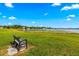 Scenic lake view with a bench, offering a peaceful retreat and natural beauty at 13696 Orange Sunset Dr # 13696, Tampa, FL 33618