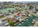 Coastal home aerial view features a pool, dock for boating, and waterfront access at 13704 Evelane Dr, Hudson, FL 34667