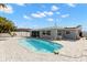 Private backyard with a sparkling swimming pool and tiled patio area, perfect for outdoor enjoyment at 13704 Evelane Dr, Hudson, FL 34667