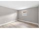 Empty bedroom featuring one window and light laminate flooring at 13704 Evelane Dr, Hudson, FL 34667