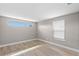 Cozy bedroom with light wood flooring and windows with natural light at 13704 Evelane Dr, Hudson, FL 34667
