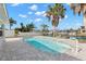 Inviting pool with palm trees, dock access and view of waterfront at 13704 Evelane Dr, Hudson, FL 34667