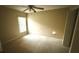 Simple bedroom features neutral walls, plush carpeting, a window with ample natural light, and ceiling fan at 1510 Sakonnet Ct, Brandon, FL 33511
