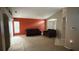 Spacious living room offering comfortable seating, neutral carpeting, and large windows with ample natural light at 1510 Sakonnet Ct, Brandon, FL 33511