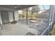 View of the screened-in patio with its round brick-lined feature, seamlessly blending indoor/outdoor living at 1510 Sakonnet Ct, Brandon, FL 33511