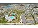 Aerial view showcasing a planned community with ponds, playgrounds, parks and residential homes at 15959 Tuscany Hillside Rd, Odessa, FL 33556