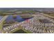 Aerial view of the home in a community with a pond, trees, and well-maintained lawns with houses nearby at 15959 Tuscany Hillside Rd, Odessa, FL 33556