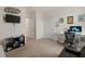 Bedroom with workstation, black futon, neutral carpet, and black shelf at 15959 Tuscany Hillside Rd, Odessa, FL 33556