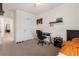 Comfortable bedroom with desk, orange bedding, and neutral carpet at 15959 Tuscany Hillside Rd, Odessa, FL 33556