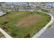 Aerial view of the community playing field with soccer goals, grass and sidewalks in a residential neighborhood at 15959 Tuscany Hillside Rd, Odessa, FL 33556