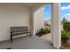 Inviting front porch with a bench, offering a relaxing outdoor space at 15959 Tuscany Hillside Rd, Odessa, FL 33556