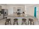 Large kitchen island with barstool seating and ample counter space for cooking and entertaining at 15959 Tuscany Hillside Rd, Odessa, FL 33556
