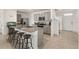 Bright and spacious kitchen with island seating and modern stainless steel appliances at 15959 Tuscany Hillside Rd, Odessa, FL 33556