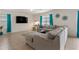 Comfortable living room featuring a large sectional sofa and a flat-screen TV at 15959 Tuscany Hillside Rd, Odessa, FL 33556