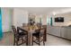 Open living concept with dining and kitchen adjacent to the living area at 15959 Tuscany Hillside Rd, Odessa, FL 33556