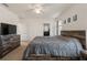 Spacious bedroom featuring rustic wood furnishings, neutral carpet, and ceiling fan at 15959 Tuscany Hillside Rd, Odessa, FL 33556