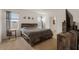 Spacious bedroom with rustic wood furnishings, neutral carpet, and bright natural light at 15959 Tuscany Hillside Rd, Odessa, FL 33556