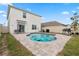 Private in-ground pool with pavers, lounge chairs, grill, and fenced-in yard, backing to the house at 15959 Tuscany Hillside Rd, Odessa, FL 33556
