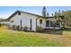The exterior features well-maintained siding and a green lawn at 1605 W Dorchester Dr, Palm Harbor, FL 34684
