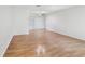 Spacious living room with hardwood floors and natural light streaming in from a window at 1605 W Dorchester Dr, Palm Harbor, FL 34684