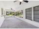 Spacious sunroom with tiled floor, ceiling fans, and screened windows, offering a bright and airy space at 1605 W Dorchester Dr, Palm Harbor, FL 34684