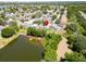 Aerial view displays a home in community near a tranquil pond, highlighted by a location marker at 1652 Wakefield Dr, Brandon, FL 33511