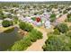Aerial shot shows houses by a pond, marked with a locator in a residential community at 1652 Wakefield Dr, Brandon, FL 33511