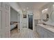 Main bathroom features a double vanity, walk-in shower, and an entrance to the main bedroom at 1652 Wakefield Dr, Brandon, FL 33511