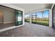 Large screened-in lanai with pavers and sliding glass doors at 1770 Pepper Grass Dr, North Port, FL 34289