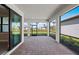 Screened-in lanai with brick pavers and a view of the fenced backyard at 1770 Pepper Grass Dr, North Port, FL 34289