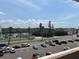 Scenic street view featuring palm trees and a glimpse of a nearby river at 18304 Gulf Blvd # 309, Redington Shores, FL 33708