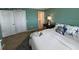 Bright bedroom with a coastal theme and a plush white comforter at 18304 Gulf Blvd # 309, Redington Shores, FL 33708
