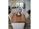 Dining area adjacent to the kitchen, featuring seating for six at 18304 Gulf Blvd # 309, Redington Shores, FL 33708