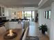Bright dining area with views of the kitchen and living room at 18304 Gulf Blvd # 309, Redington Shores, FL 33708