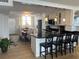 Kitchen featuring white cabinets, breakfast bar, and stainless steel appliances at 18304 Gulf Blvd # 309, Redington Shores, FL 33708