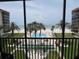 View from the balcony of the community pool, shuffleboard, beach and ocean at 18304 Gulf Blvd # 309, Redington Shores, FL 33708