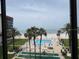 View of a beachfront pool and shuffleboard courts at 18304 Gulf Blvd # 309, Redington Shores, FL 33708