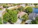Overhead view of a private residence backing onto a pond with mature trees and landscaping at 19227 Garden Quilt Cir, Lutz, FL 33558