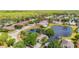 Scenic aerial view of a residential neighborhood featuring ponds and lush green landscaping at 19227 Garden Quilt Cir, Lutz, FL 33558