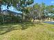 Expansive backyard overlooking a tranquil lake, with a screened-in pool adding to the outdoor enjoyment at 19227 Garden Quilt Cir, Lutz, FL 33558