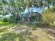 Lush backyard with a screened-in pool, offering privacy and a peaceful retreat in a natural setting at 19227 Garden Quilt Cir, Lutz, FL 33558