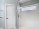 Bathroom featuring glass enclosed shower, neutral walls, and white trim offer a clean, modern style at 19227 Garden Quilt Cir, Lutz, FL 33558