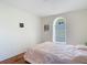 Bedroom with light walls and gleaming wood floors, offers a cozy private space at 19227 Garden Quilt Cir, Lutz, FL 33558