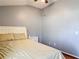 Serene bedroom featuring a bed, nightstand, and soft lighting for a comfortable retreat at 19227 Garden Quilt Cir, Lutz, FL 33558